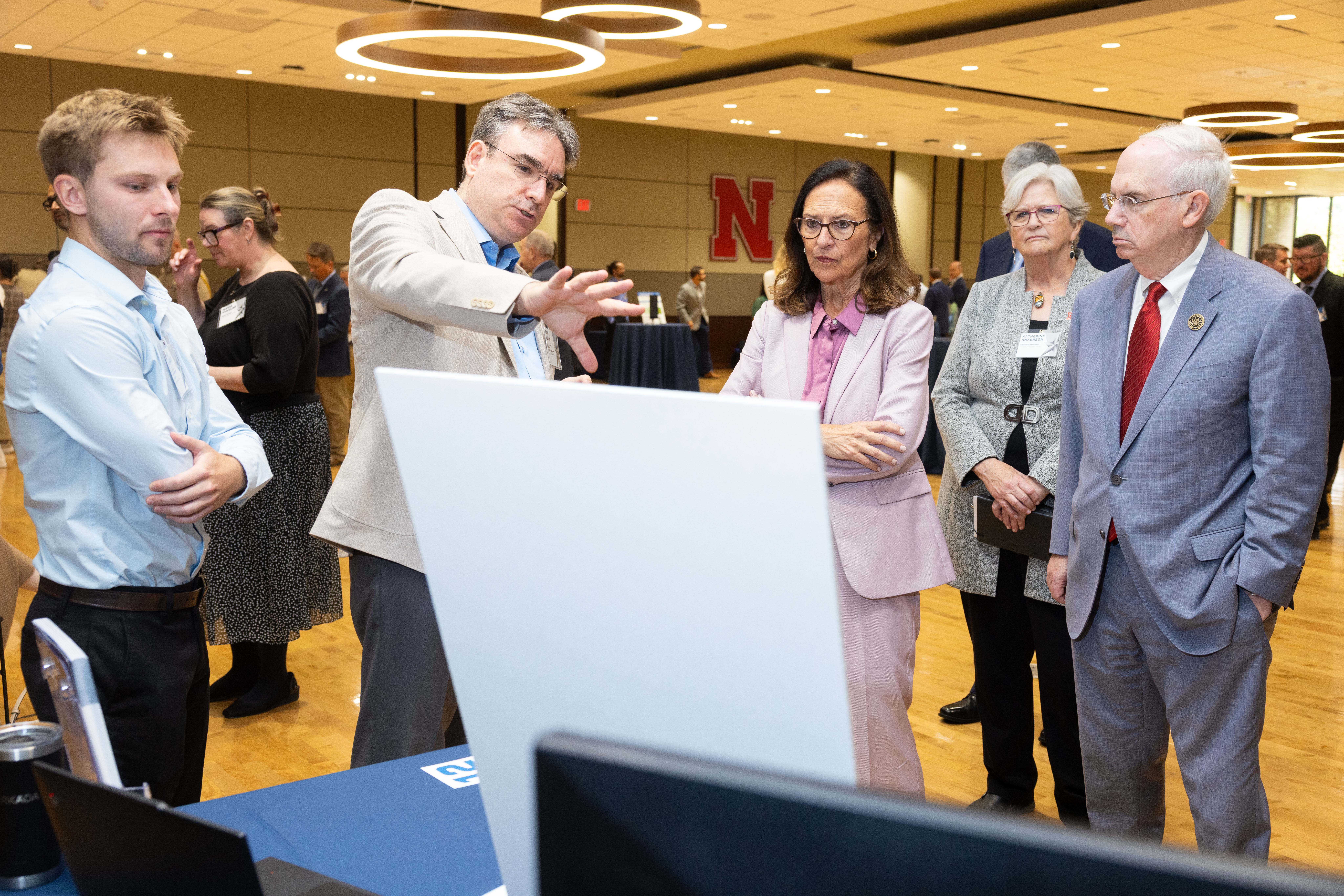 U.S. Senator Deb Fischer (middle) discusses unique capabilities and solutions with Can Vuran (second from left), Dale M. Jensen Chair Professor in the UNL School of Computing and director of the Cyber-Physical Networking Lab. 